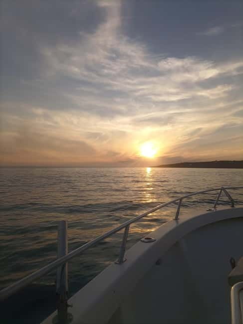 Cascais: Sunset Boat Trip with Welcome Drinks - Costa da Guia and the sunset itself