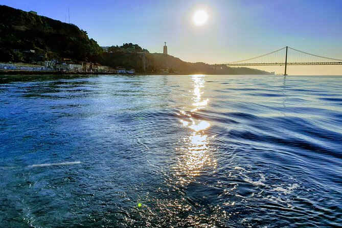 Daytime/Lisbon Sunset Boat with history and wine (small group) - Wine, juice, and a Portuguese pastry