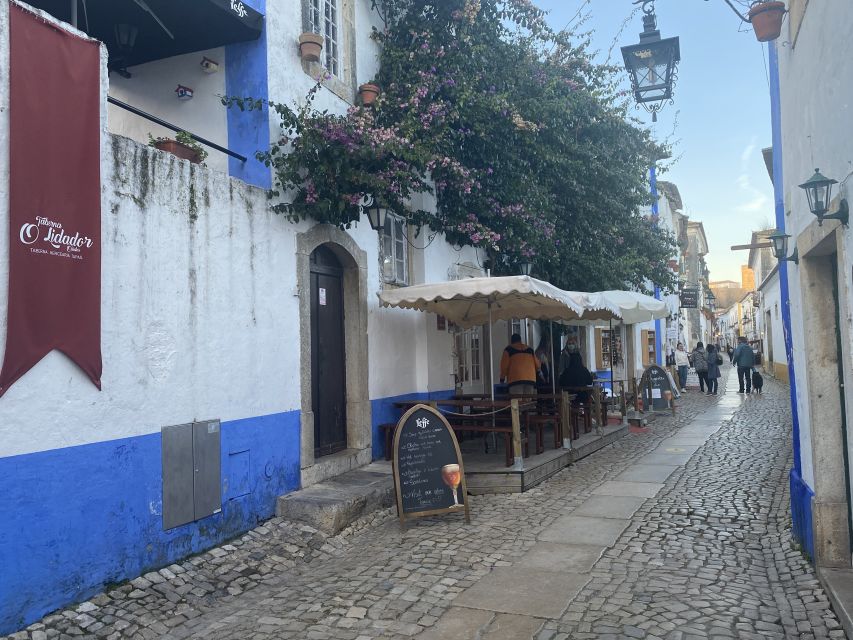 From Lisbon: Fátima, Batalha, Nazaré, and Obidos Tour by Van - Óbidos: cobblestones, castle walls, and chocolate cups