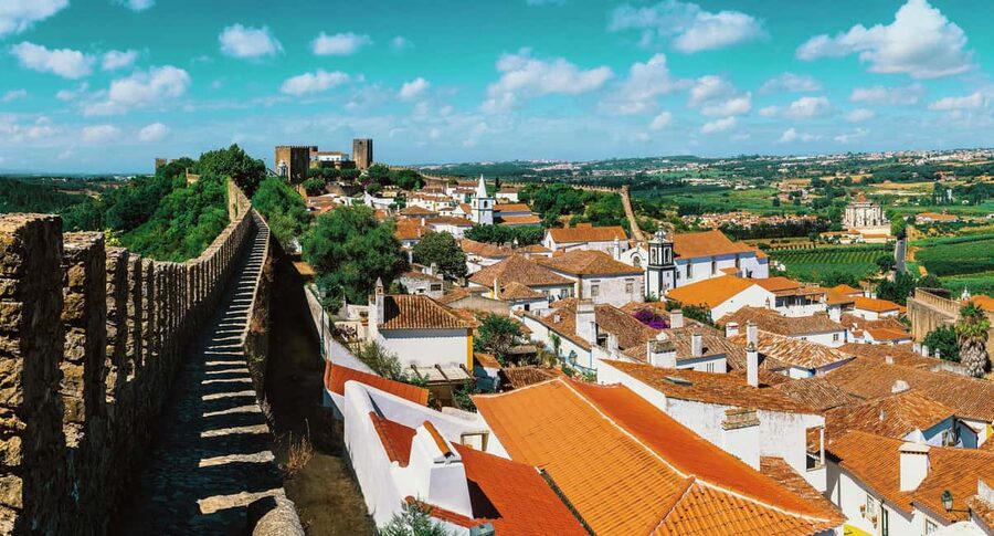 From Lisbon: Nazare Big Waves and Óbidos Guide Day Trip - Nazaré’s lighthouse and Atlantic viewpoints