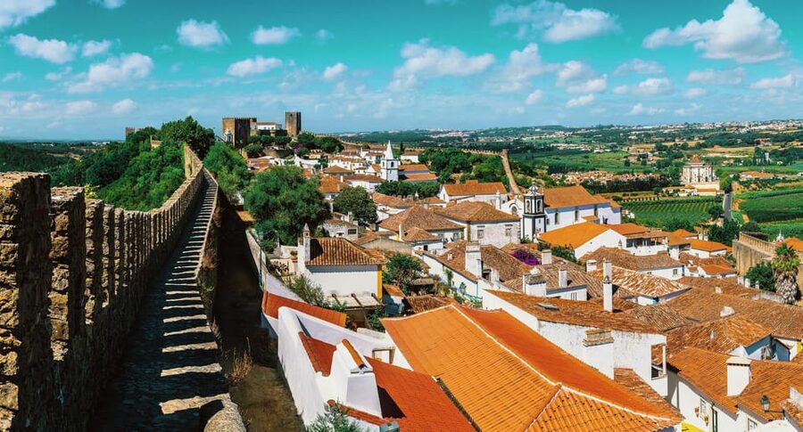 From Lisbon: Nazare Big Waves and Óbidos Guide Day Trip - Entering Óbidos through the medieval walls