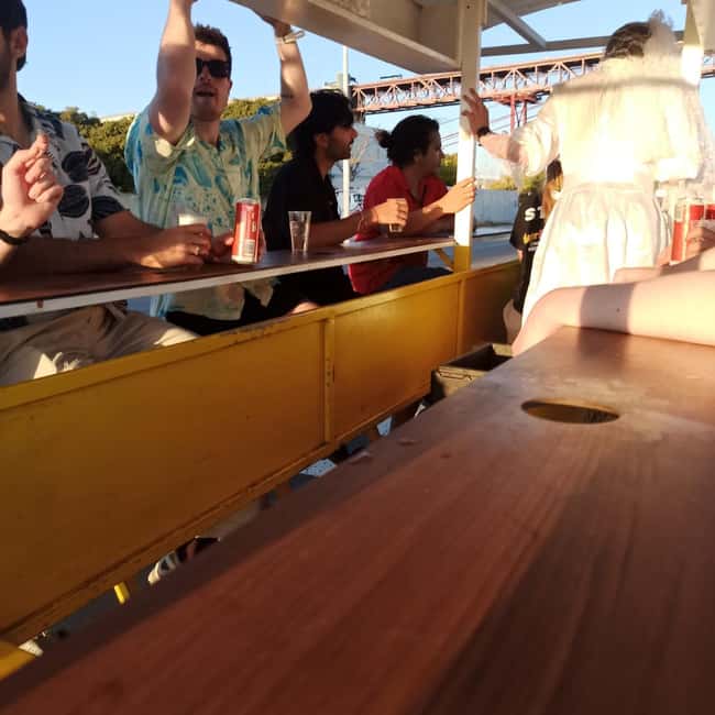 Lisbon: 1-Hour Beer or Sangria Bike Sightseeing Tour - Boarding the yellow bike at Av. da Índia