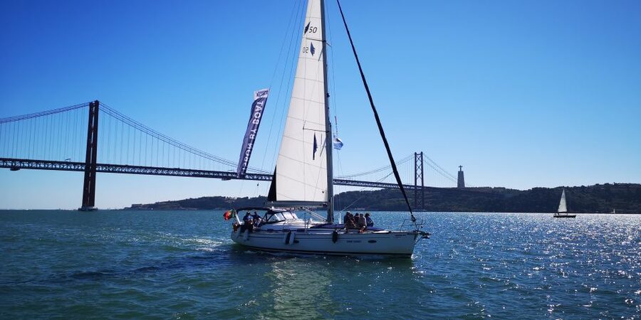 Lisbon: 2-Hour Sailing Yacht Cruise & Guided Tour w/2 drinks - Crossing toward the Vasco da Gama Bridge