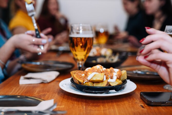 Lisbon: Award-Winning Guided Walking Food Tour with Local Drinks - Sardines and seafood rice on Rua da Vitória