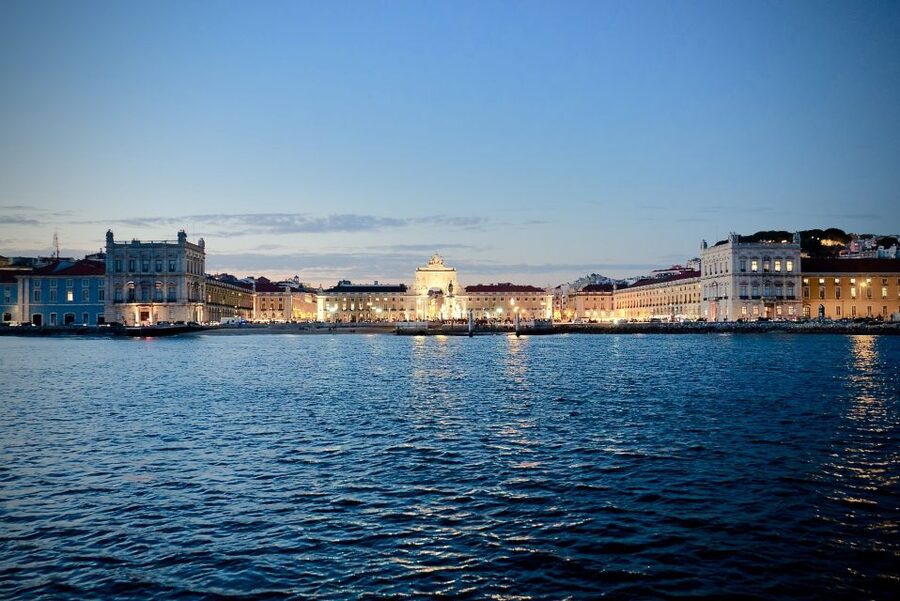 Lisbon: Boat Cruise with Live Fado Performance and a Drink - Passing Commerce Square from the water