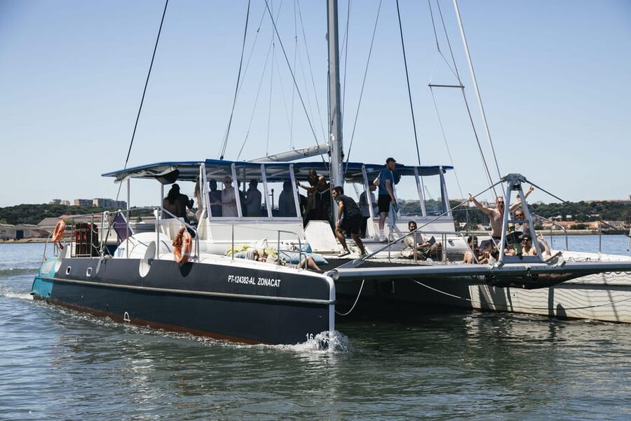 Lisbon: Catamaran Boat Party with Music, Open Bar & Dives - Starting at Doca de Santo Amaro in Alcântara