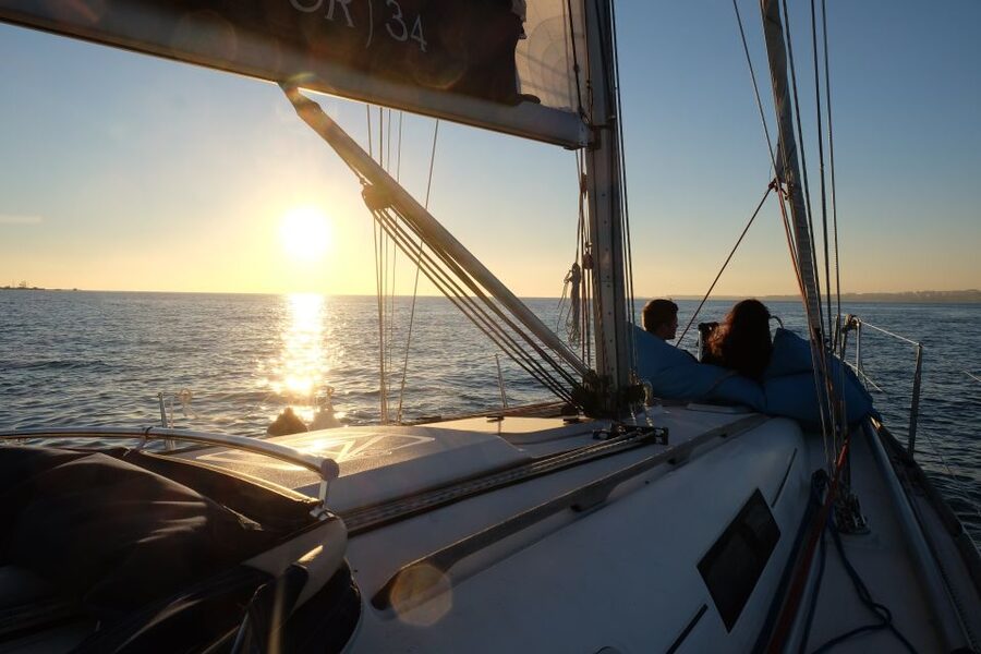 Lisbon: City Skyline Sailboat Cruise with Drink and Snacks - Sunset departures and changing weather