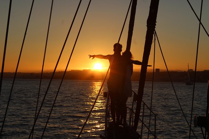 Lisbon: Daylight or Sunset on a Vintage Sailboat - Under the 25 de Abril Bridge toward central Lisbon