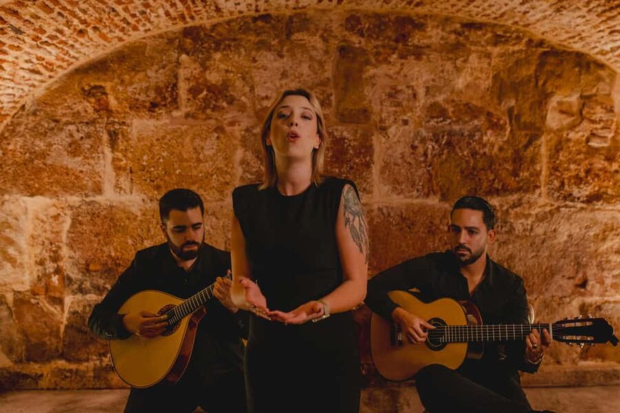 Lisbon: Fado Show with Wine in a Historic Venue - Entering Lisbon’s old stone walls
