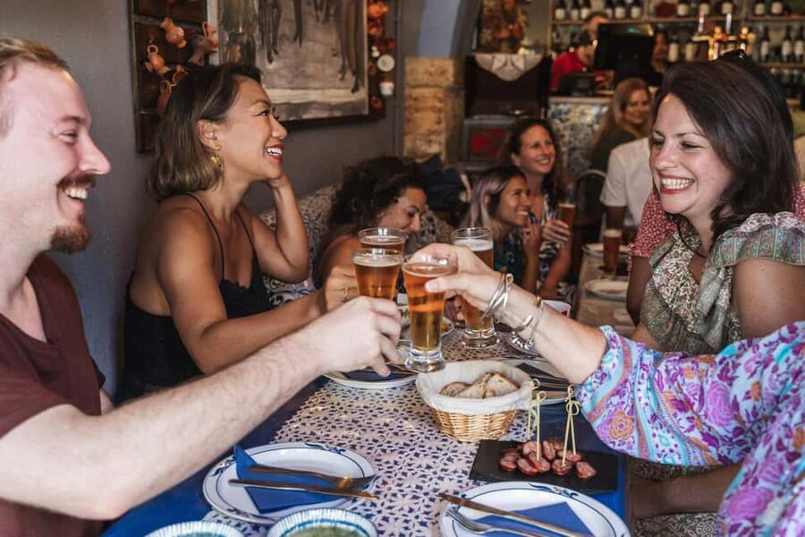 Lisbon: Food Crawl Walking Tour with Local Tastings - A glimpse toward Alfama and the Rua Augusta finish