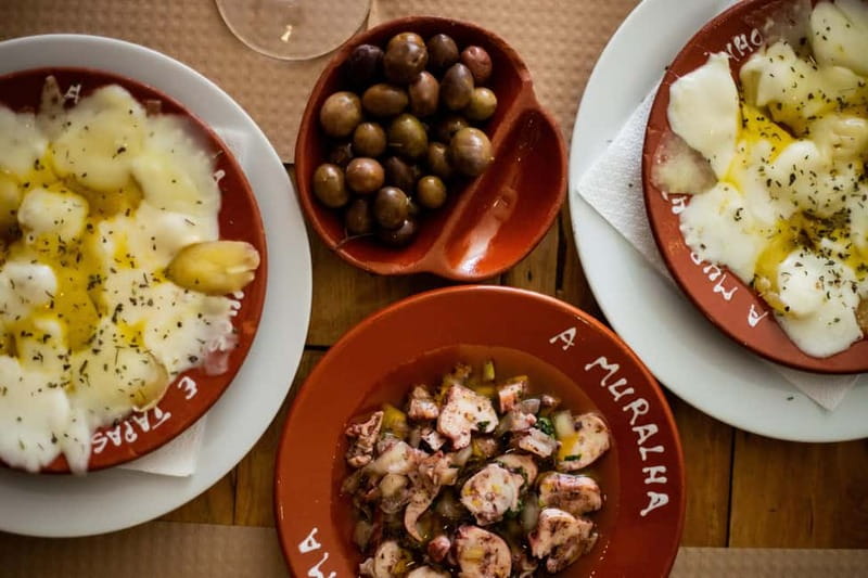 Lisbon: Food Tasting Tour by Tuk Tuk with 2 Stops - Alfama brings music, wine, and old Lisbon streets