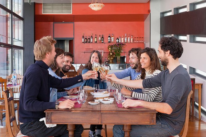 Lisbon Food Tour with 3 Stops and Fado Show Performance - Stop two: Portuguese wine, local cheese, and petiscos