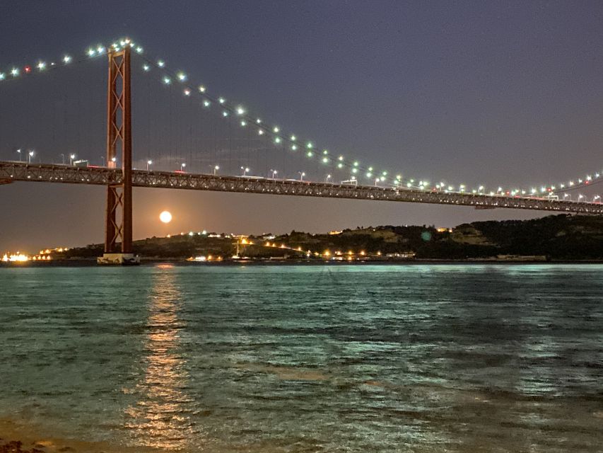 Lisbon: Luxury Sailboat Cruise at Night - Passing beneath the 25 de Abril Bridge