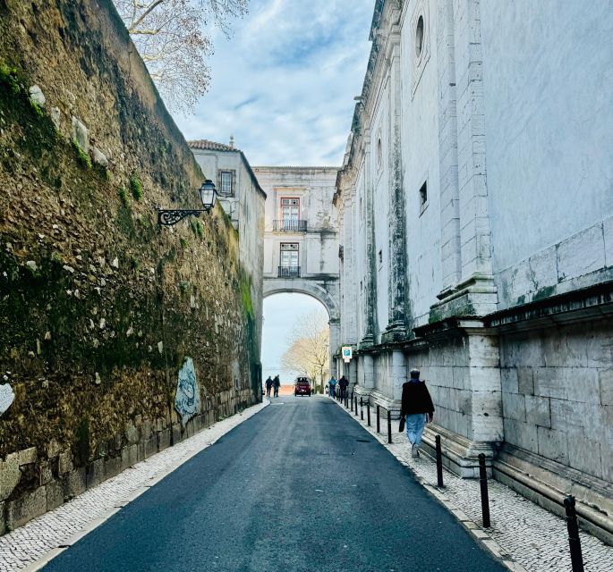 Lisbon: Private Sightseeing Tour by Tuk-Tuk - Lisbon Cathedral and the first climb into Alfama