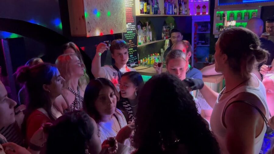 Lisbon Pub Crawl: Unlimited Drinks, Shots & V.I.P Club Entry - Walking through Bairro Alto