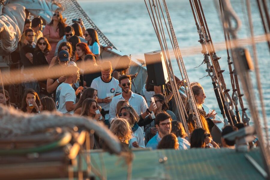 Lisbon: Sunset Boat Party with Live DJ and Night Club Entry - Languages, age limit, and booking flexibility