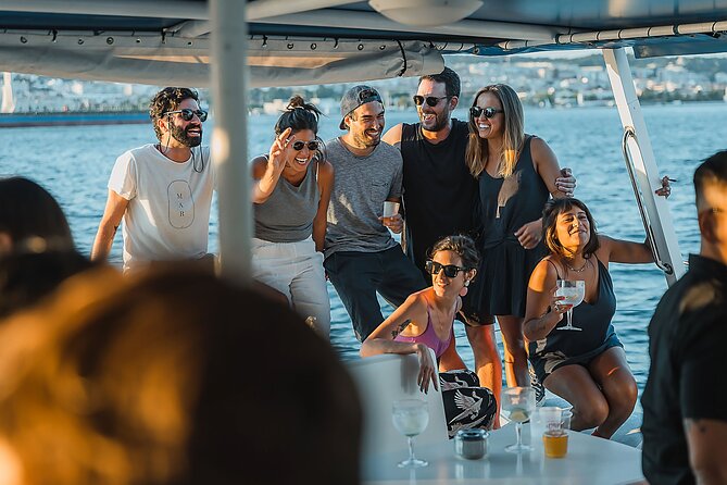 Lisbon : Sunset Catamaran Boat Tour with Music and Drinks - Passing beneath the April 25 Bridge