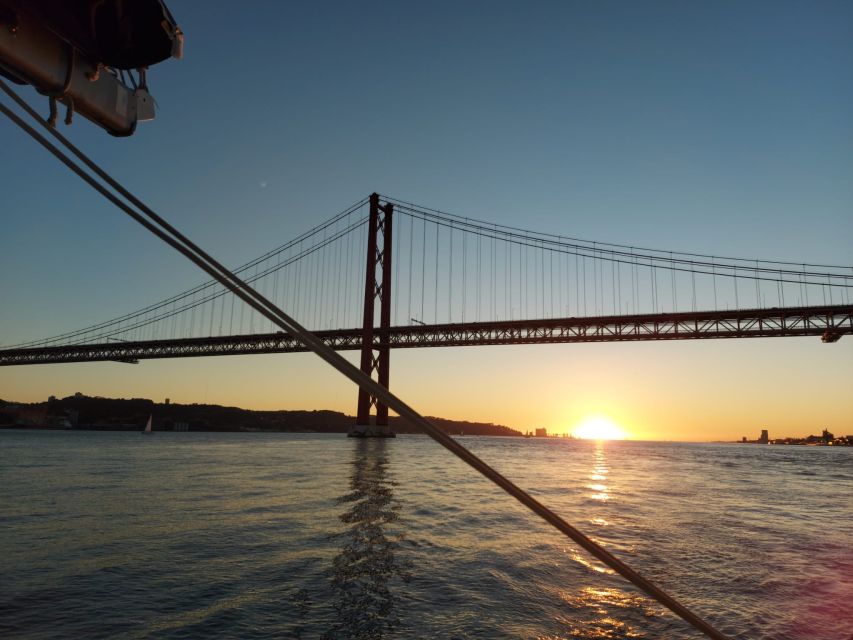 Lisbon: Sunset Catamaran Cruise with Drinks - Passing beneath the 25 de Abril Bridge