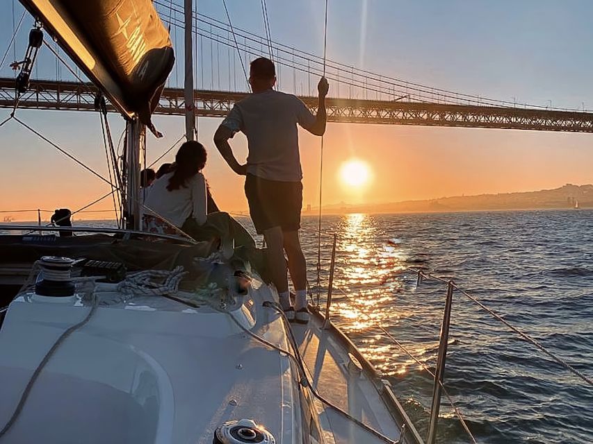 Lisbon: Sunset Cruise with Drinks and Snacks - Under the 25 de Abril Bridge and toward central Lisbon