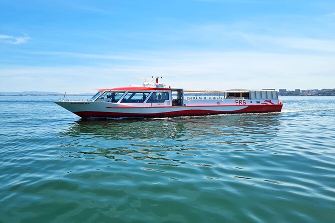 Lisbon Sunset cruise with Welcome Drink and Snack included - Passing beneath the 25 de Abril Bridge