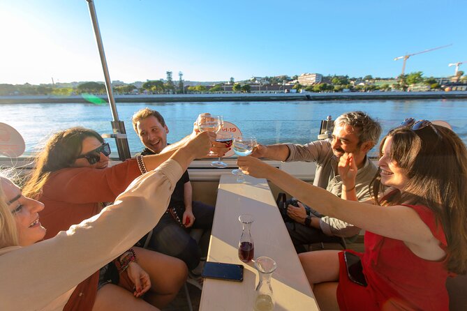 Lisbon Sunset cruise with Welcome Drink and Snack included - Christ the King across the river
