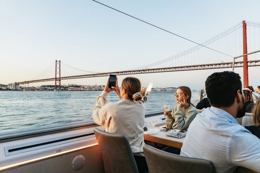 Lisbon: Sunset Cruise with Welcome Drink and Snacks - Under the 25 April Bridge