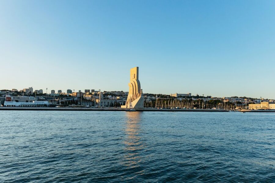 Lisbon: Sunset Cruise with Welcome Drink and Snacks - Returning past Christ the King