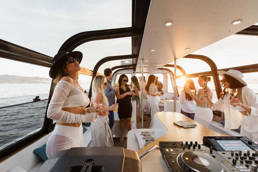 Lisbon: Sunset/Night Boat Party with Open Bar, Snacks & DJ - Commerce Square and the ride home
