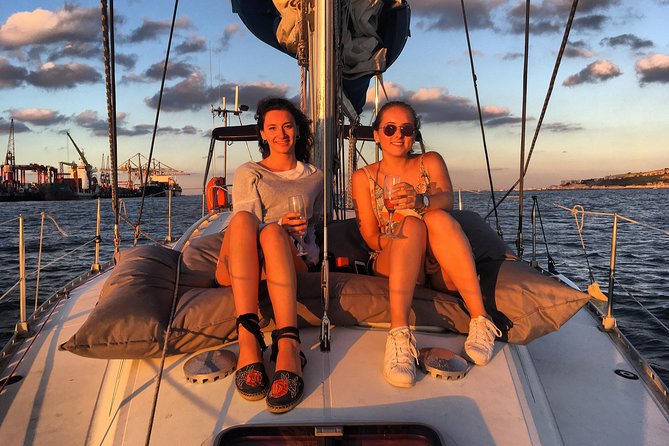 Lisbon Sunset Sailing Tour with White or Rosé Wine and Snacks - The boat, seating, and weather trade-offs