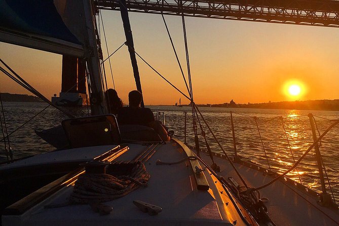 Lisbon Sunset Sailing Tour with White or Rosé Wine and Snacks - Sailing beneath the 25 de Abril Bridge