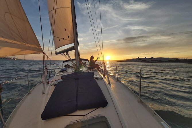 Lisbon Sunset Sailing with Portuguese Wine and History - The river’s wider reach: Vasco da Gama Bridge and Bugio