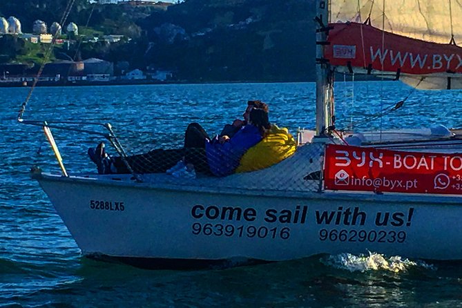 Lisbon Sunset Sensations on a Private Sailing Boat with wine&snacks - Cristo Rei across the water
