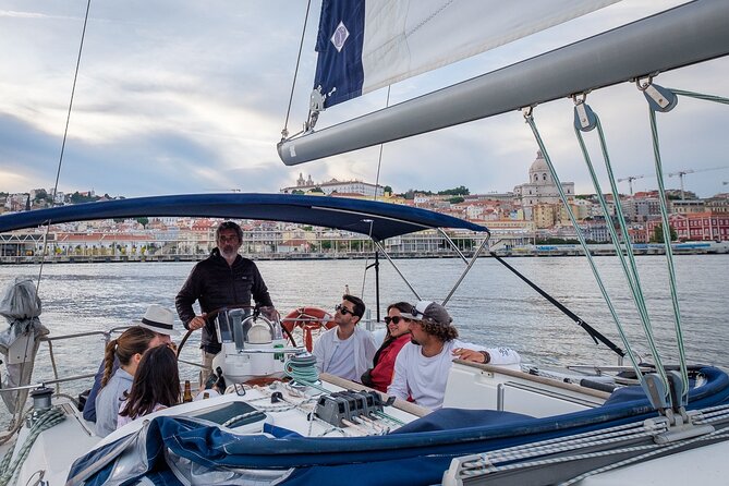 Lisbon: Sunset Tagus River Sailing Tour with Drinks - What the crew adds to the experience