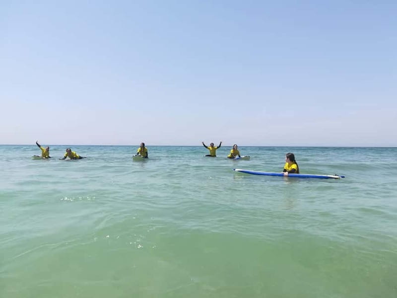 Lisbon: Surfing Lesson on Costa de Caparica Beach - Getting fitted with a board and wetsuit