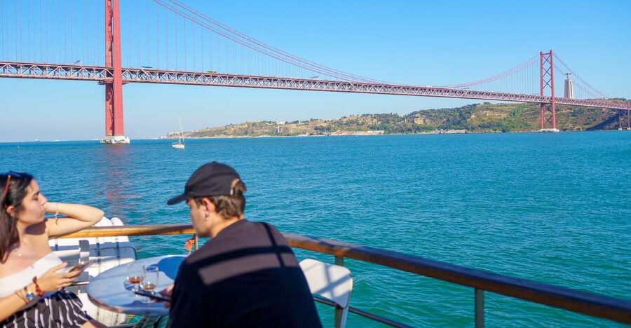 Lisbon: Tagus River Boat Tour with One Drink Included - Alfama’s old buildings from a better angle