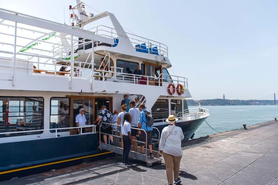 Lisbon: Tagus River Boat Tour with One Drink Included - The 25th of April Bridge overhead