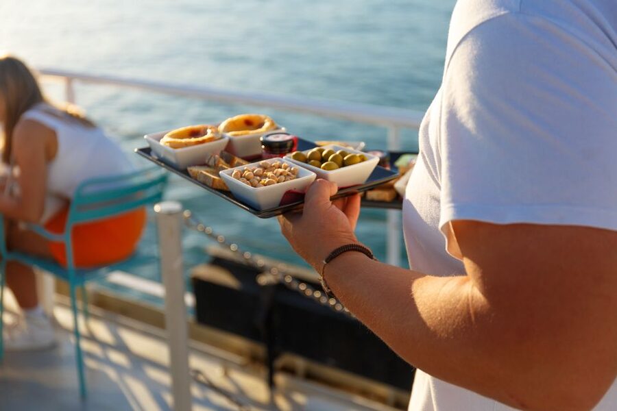 Lisbon: Tagus River Sunset Tour with Snacks and Drink - Passing beneath the 25th of April Bridge