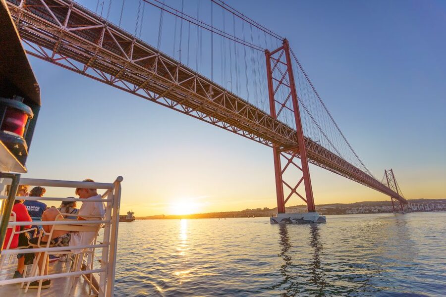 Lisbon: Tagus River Sunset Tour with Snacks and Drink - Christ the King across the water