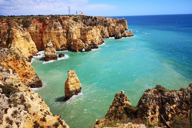 Lisbon to Algarve Private Tour: Benagil Caves Cruise & Top Sights - Lagos: history, rock formations, and lunch
