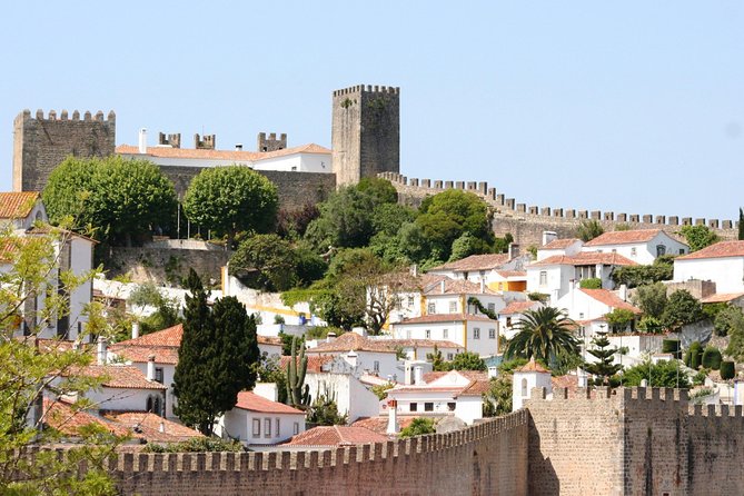 Lisbon to Porto Up To 5 Stops Óbidos Nazaré Fátima Coimbra Aveiro - Price, timing, luggage, and comfort