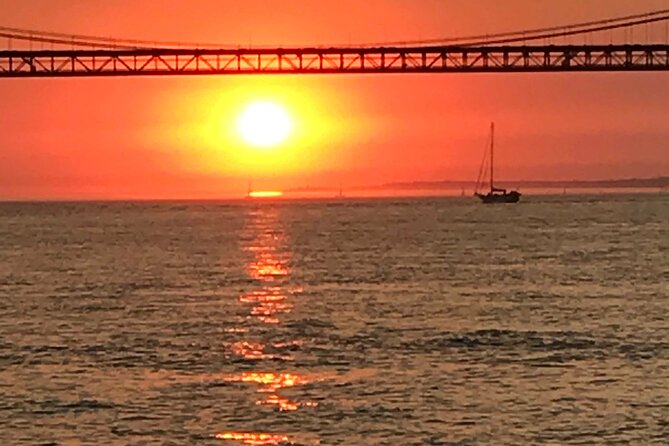LUXURY Catamaran Sunset and Wine cruise - The bridge crossing and Lisbon’s central waterfront