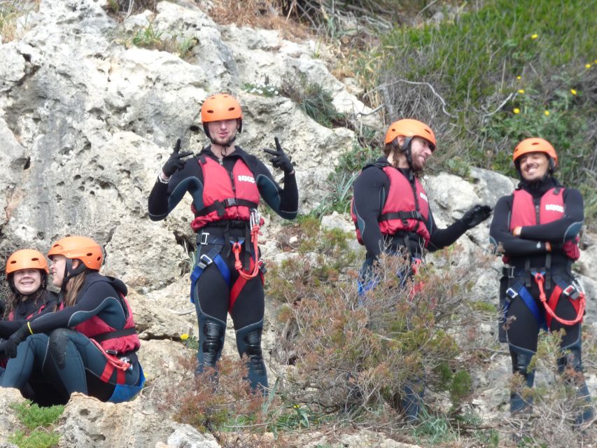Portinho da Arrábida: Coasteering Boat Tour - Rappelling down the cliffs