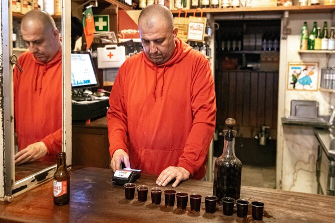 Private Night Bar Crawl in Lisbon with Local Guide and Drinks - Walking into Bairro Alto after dark