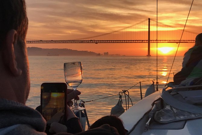 Sail & Dine Sailboat Tour With Sunset - Under the April 25 Bridge toward Cristo Rei