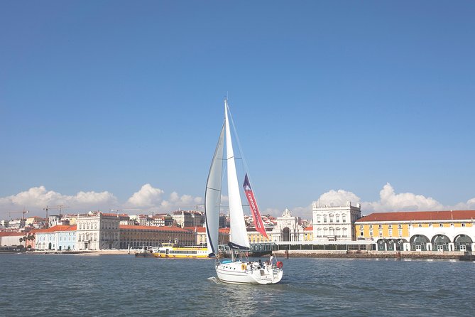 Small-Group Sailing Tour on the Tagus River from Lisbon - Under Lisbon’s red bridge