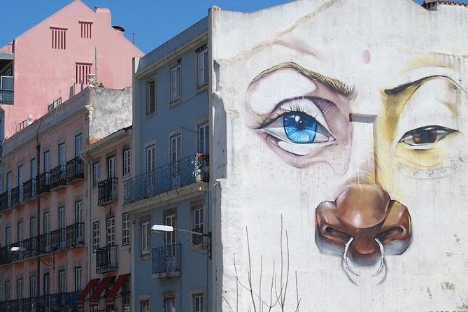 Tuk Tuk Lisbon: Exploring Urban Art - Vhils in a Narrow Lisbon Lane